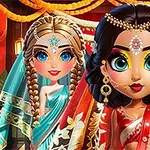 화려한 전통 의상을 입고 보석으로 장식된 두 인형이 배경에 매달린 등불과 함께 서 있는 모습