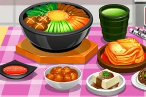 분홍색 체크 무늬 테이블보 위에 다양한 음식이 담긴 그릇과 접시들, 김치, 국, 두부 요리가 놓여 있다
