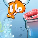 주황색 물고기가 핑크색 산호 근처를 헤엄치는 모습