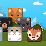 귀여운 동물 얼굴이 그려진 여섯 개의 사각형 블록이 선명한 하늘과 산을 배경으로 놓여 있다