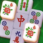 녹색 배경 위에 꽃 문양과 중국어가 새겨진 여러 개의 마작 타일이 쌓여 있습니다